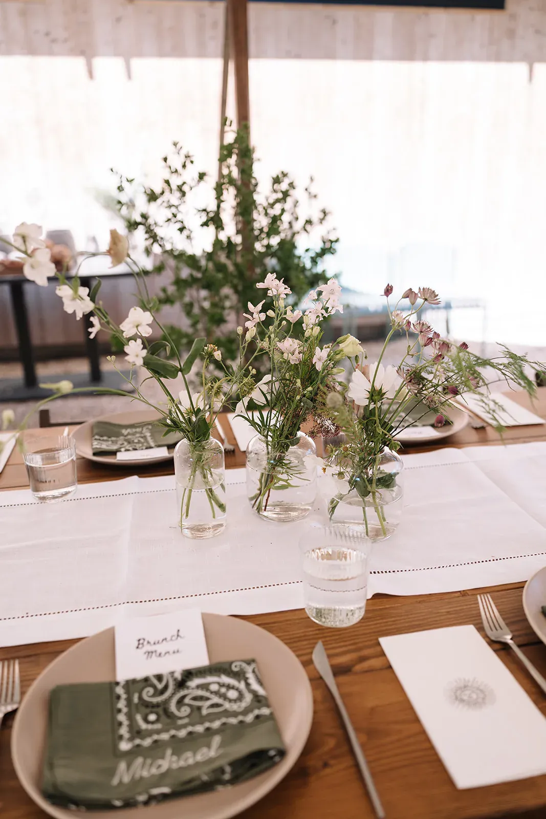 Delicate floral arrangement on a Serana reception table