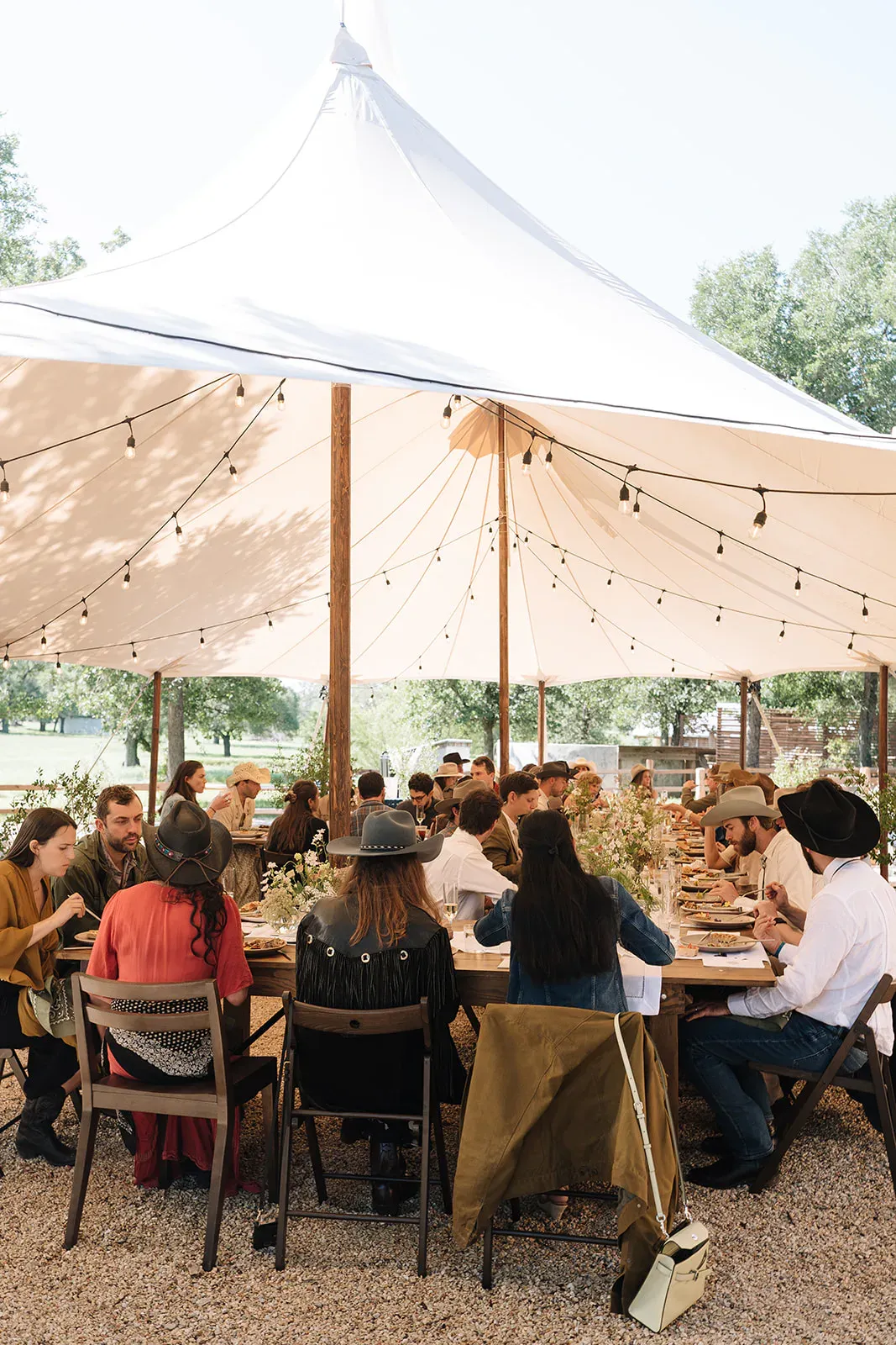 Guests seated for a hosted lunch beneath the Serana tent