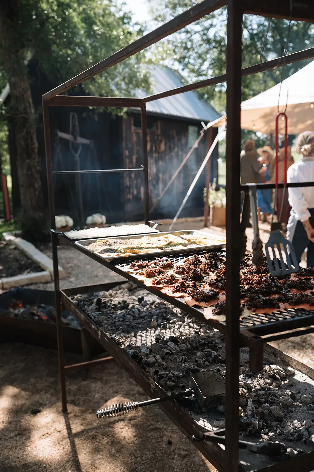 Open-fire grill preparing dinner at Serana