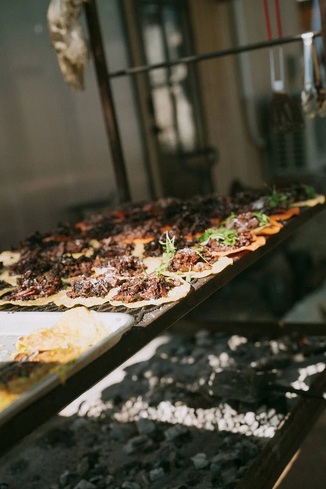 Open-flame dinner detail prepared for a Serana event