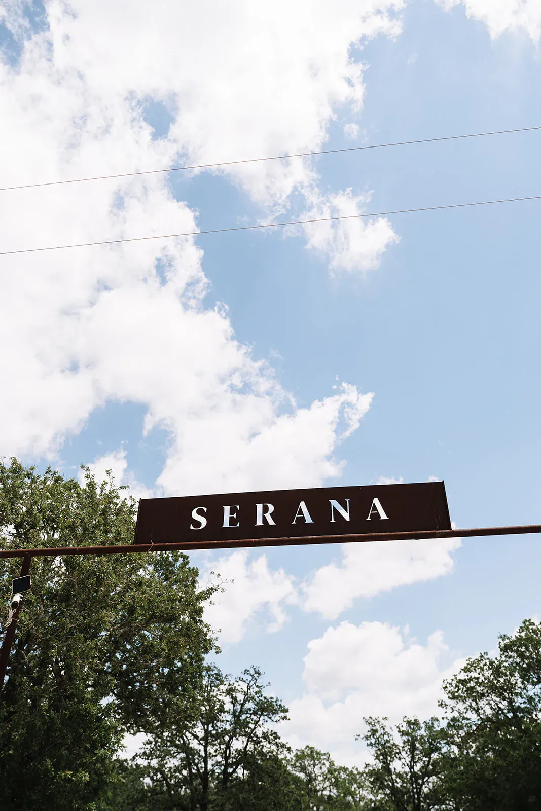 Serana property sign against blue Texas sky