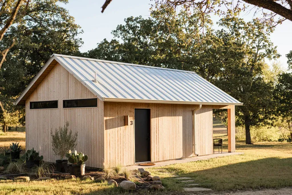 Serana cabin exterior with metal roof and wood siding