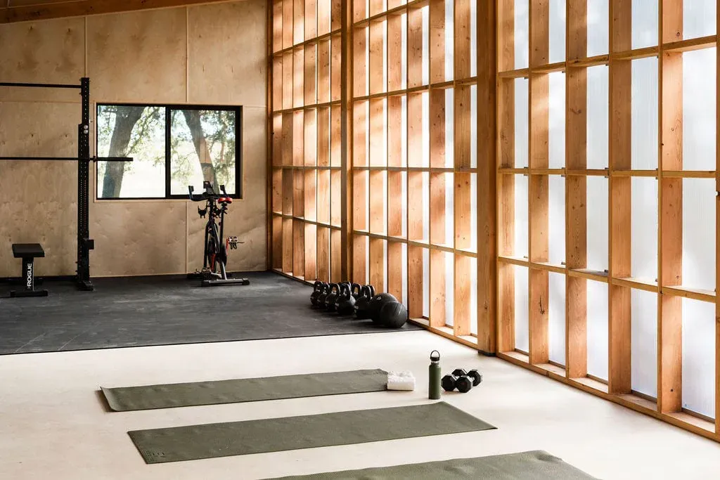 Wide fitness studio with yoga mats for Serana wellness programming