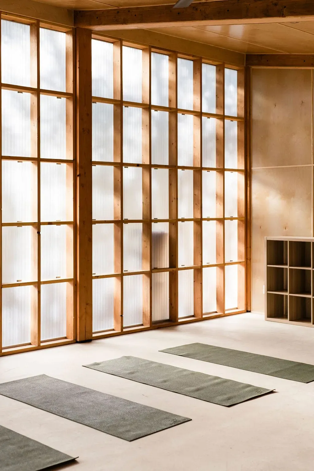 Serana fitness studio wall with mats and yoga props