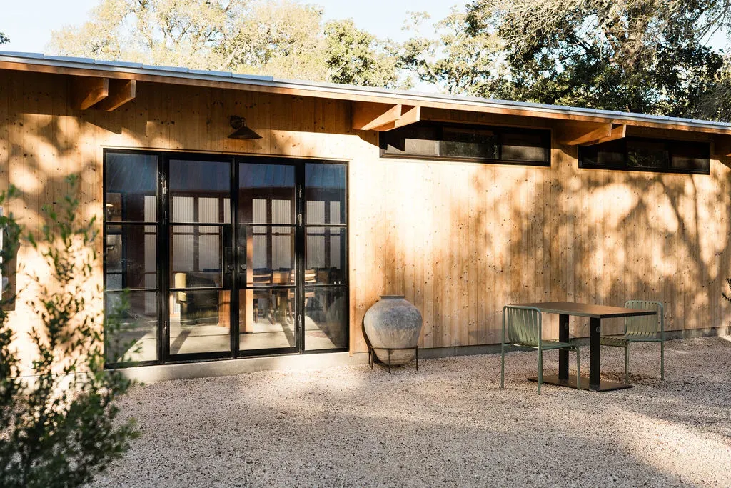 Serana lodge exterior with patio seating