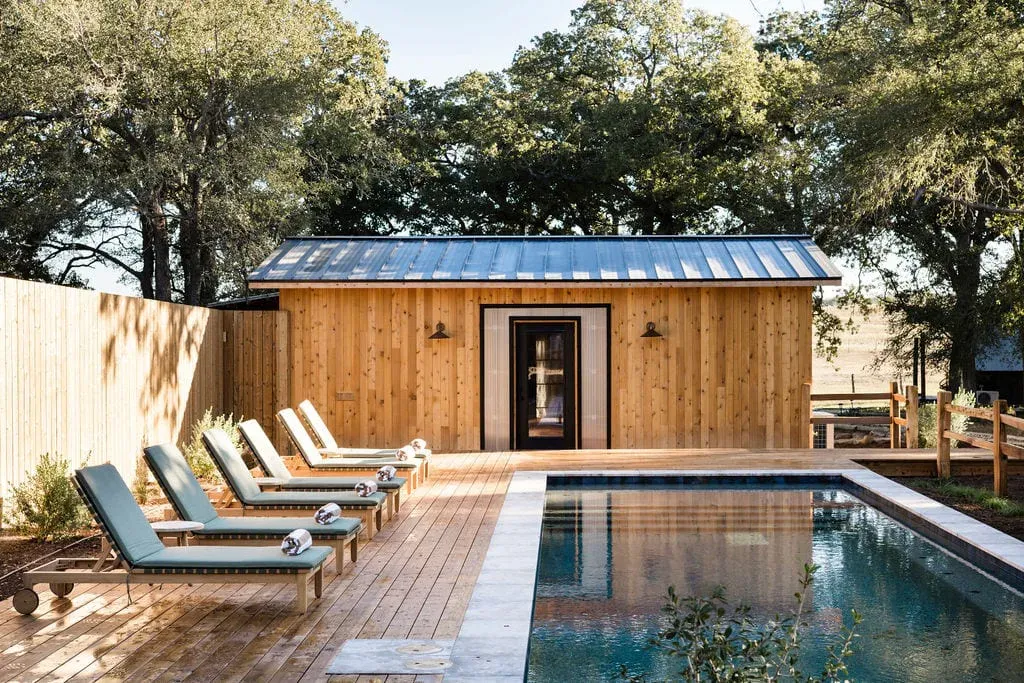 Serana saltwater pool and pool house under oak trees
