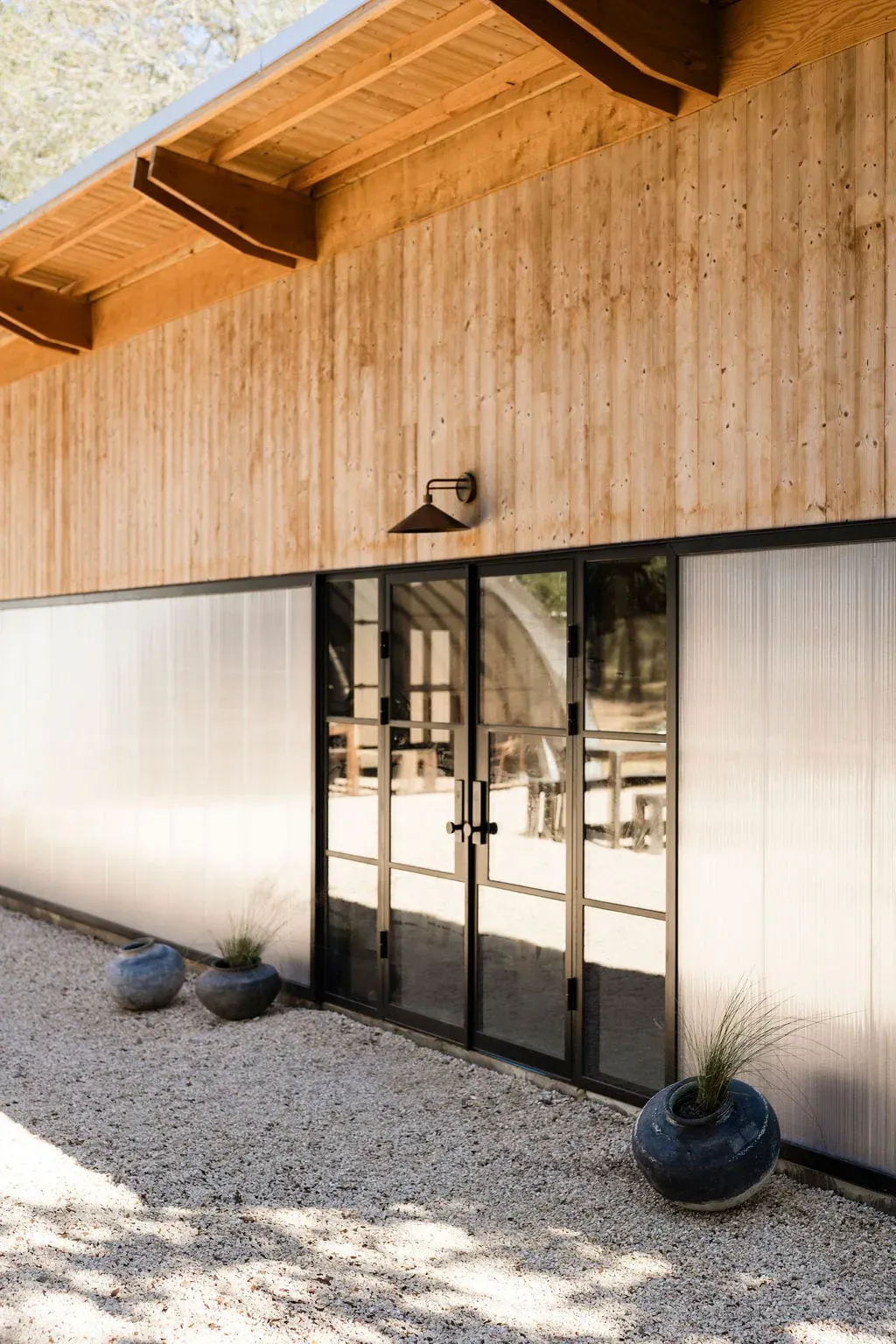 Glass doors at the Serana spa house exterior