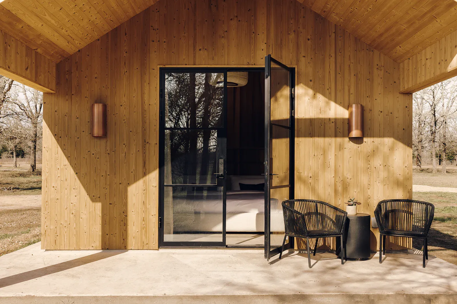 Serana spa house exterior patio with warm wood and outdoor seating