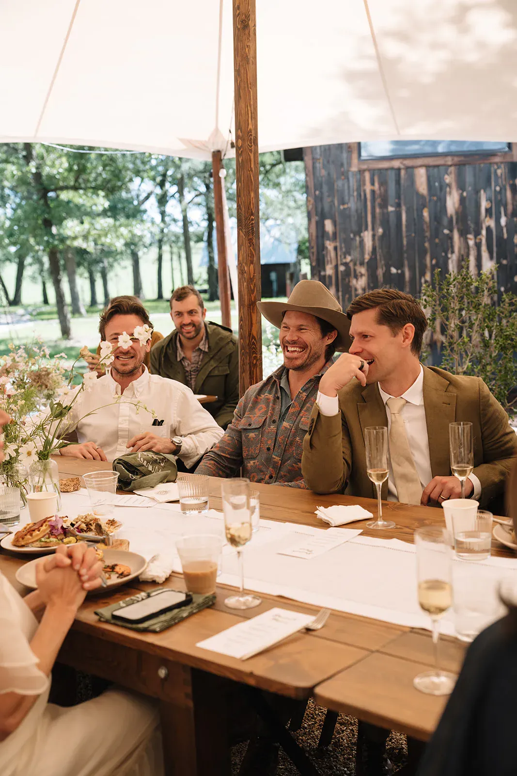 Guests talking over dinner beneath the Serana tent
