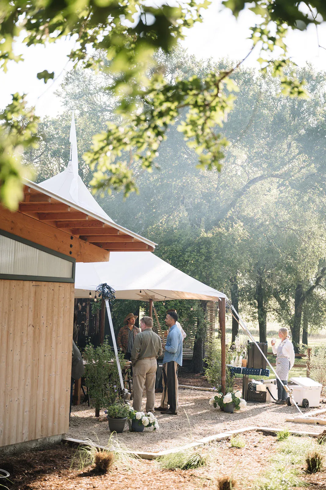 Service team preparing a tented dinner at Serana